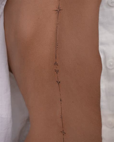 Subtle And Elegant Spine Tattoos For Women